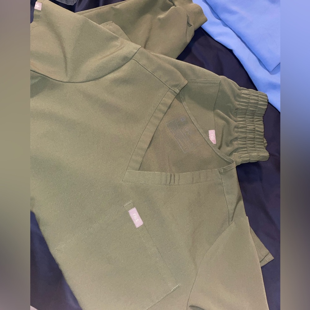 Gently worn fig brand scrubs. Olive .top: medium , bottoms medium tall
